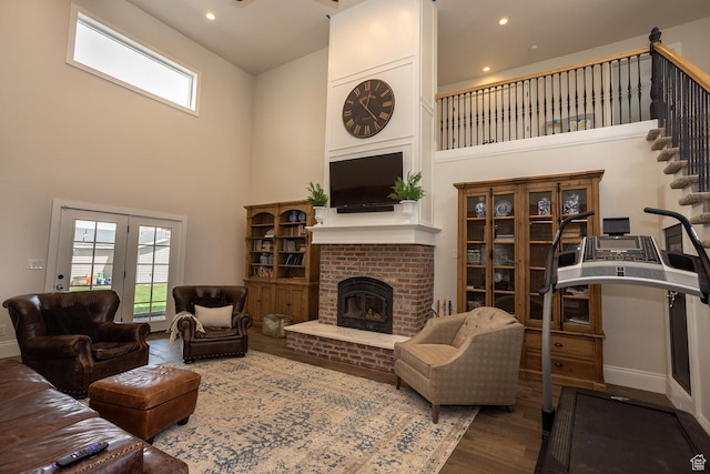 815 S Annabella Rd, Richfield, UT 84701 - living room with wood finished floors, a wealth of natural light, a high ceiling, and a fireplace