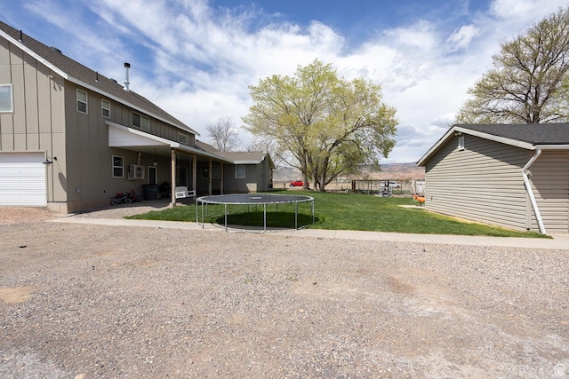 815 S Annabella Rd, Richfield, UT 84701 - view of yard with a garage and a trampoline