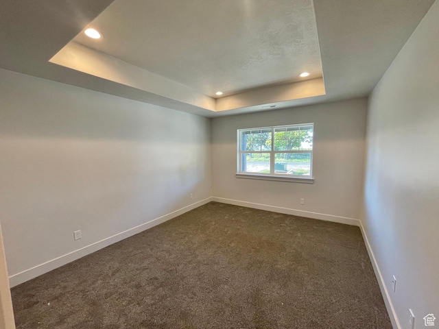 884 W Factory St, Garland, UT 84312 - empty room with baseboards, recessed lighting, and a raised ceiling