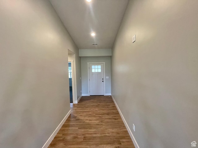 884 W Factory St, Garland, UT 84312 - doorway to outside with lofted ceiling, visible vents, baseboards, recessed lighting, and wood finished floors
