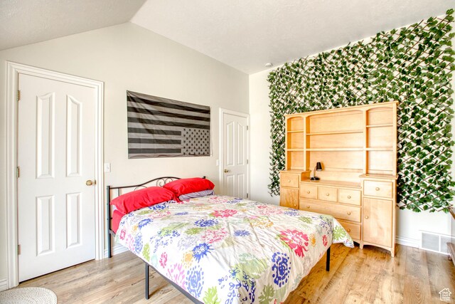 431 W 3460 N, Erda, UT 84074 - bedroom featuring visible vents, baseboards, vaulted ceiling, and light wood-type flooring