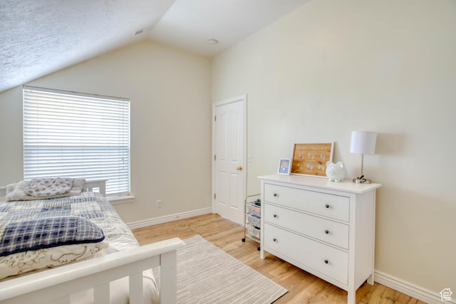 431 W 3460 N, Erda, UT 84074 - bedroom featuring baseboards, vaulted ceiling, and light wood-type flooring