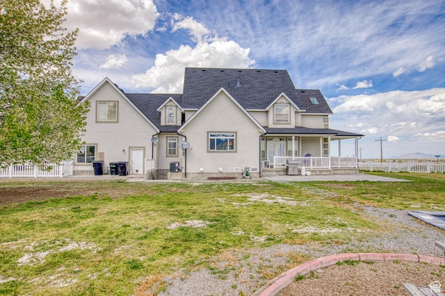 431 W 3460 N, Erda, UT 84074 - rear view of house with covered porch, fence, stucco siding, and a yard