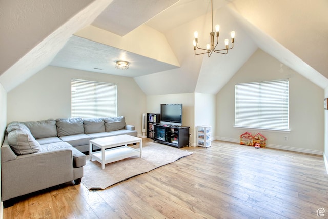 431 W 3460 N, Erda, UT 84074 - living room featuring baseboards, a notable chandelier, light wood-style floors, and vaulted ceiling