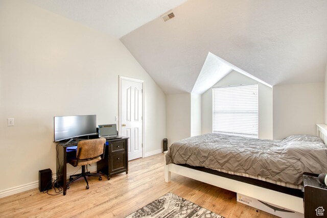 431 W 3460 N, Erda, UT 84074 - bedroom featuring baseboards, visible vents, light wood finished floors, and vaulted ceiling