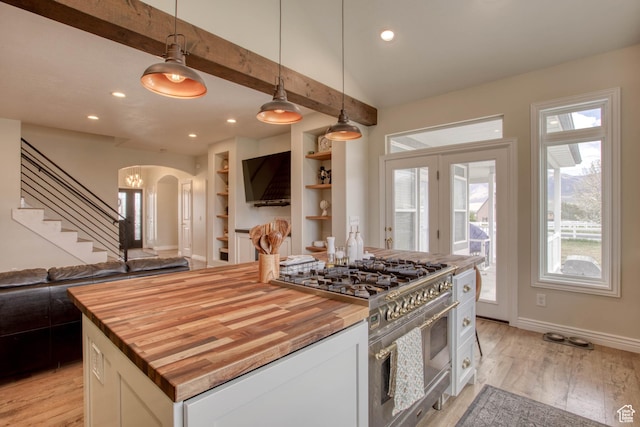 431 W 3460 N, Erda, UT 84074 - kitchen featuring wooden counters, arched walkways, open floor plan, and high end stove