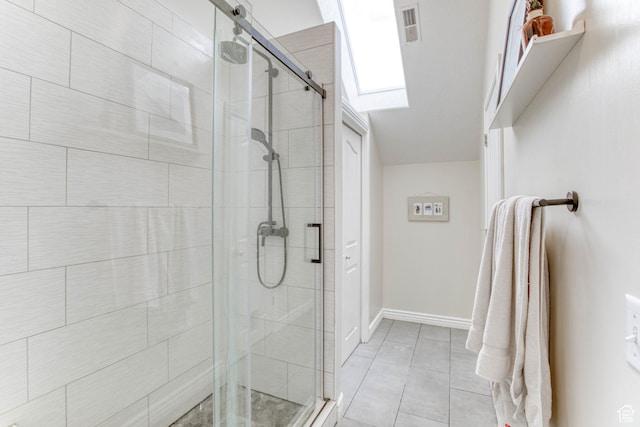 431 W 3460 N, Erda, UT 84074 - bathroom with a shower stall, visible vents, baseboards, tile patterned floors, and a skylight