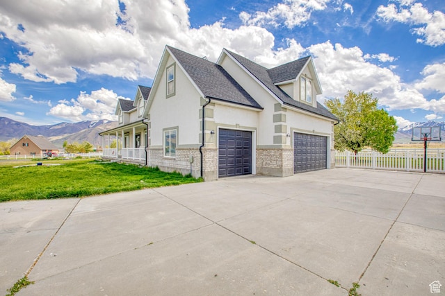 431 W 3460 N, Erda, UT 84074 - view of home's exterior featuring stucco siding, a yard, fence, driveway, and a mountain view