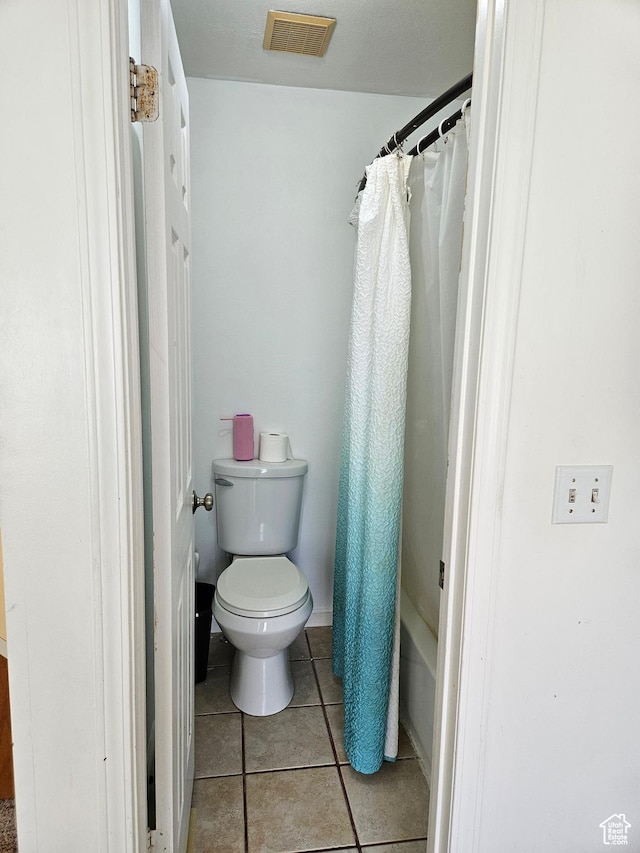 1381 W Beacon Hill Dr S, Taylorsville, UT 84123 - full bathroom with toilet, tile patterned floors, and a shower with shower curtain