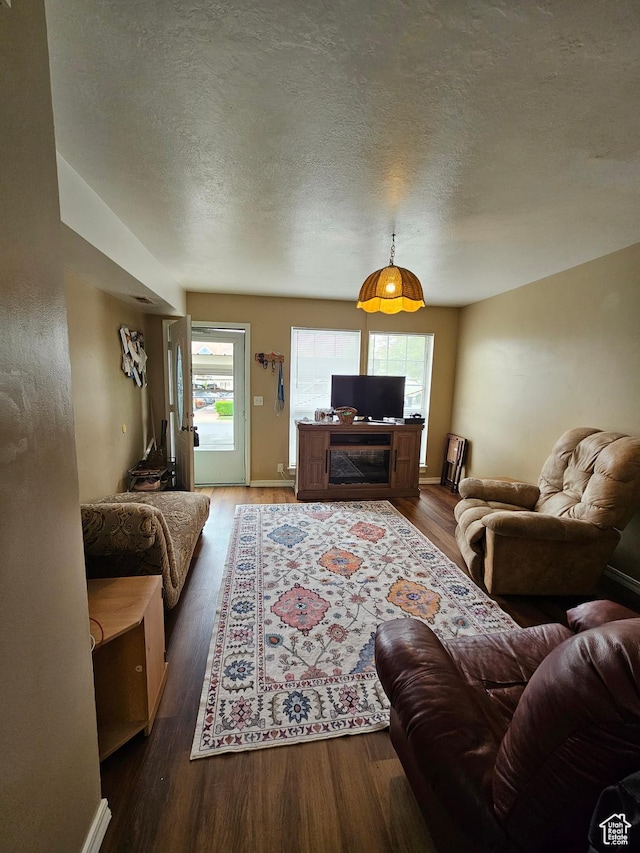 1381 W Beacon Hill Dr S, Taylorsville, UT 84123 - living area featuring wood finished floors and a textured ceiling