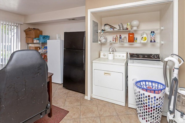1381 W Beacon Hill Dr S, Taylorsville, UT 84123 - washroom featuring separate washer and dryer, light tile patterned flooring, and electric panel