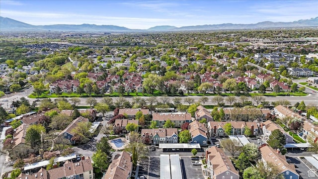 1381 W Beacon Hill Dr S, Taylorsville, UT 84123 - aerial view of property and surrounding area featuring a mountainous background and nearby suburban area
