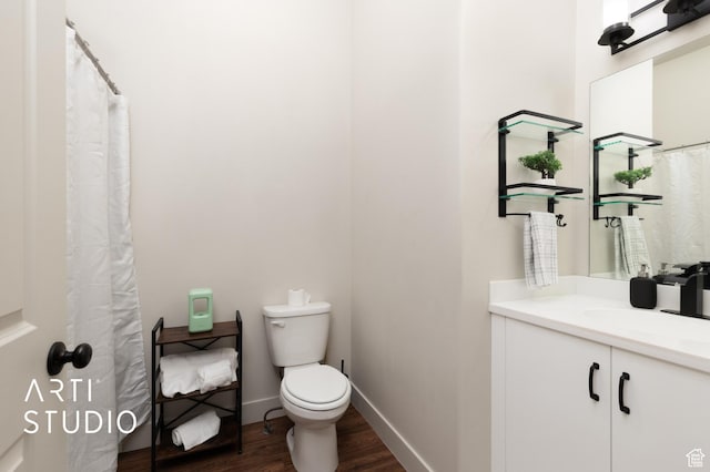 1004 N 1090 W Unit 401, Orem, UT 84057 - bathroom featuring wood finished floors, toilet, vanity, and baseboards