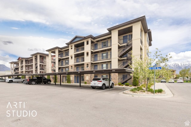 1004 N 1090 W Unit 401, Orem, UT 84057 - view of apartment building / complex featuring covered parking
