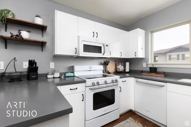 1004 N 1090 W Unit 401, Orem, UT 84057 - kitchen featuring white appliances, dark countertops, dark wood finished floors, and white cabinets