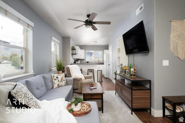 1004 N 1090 W Unit 401, Orem, UT 84057 - living room with a ceiling fan, light wood-style flooring, and baseboards