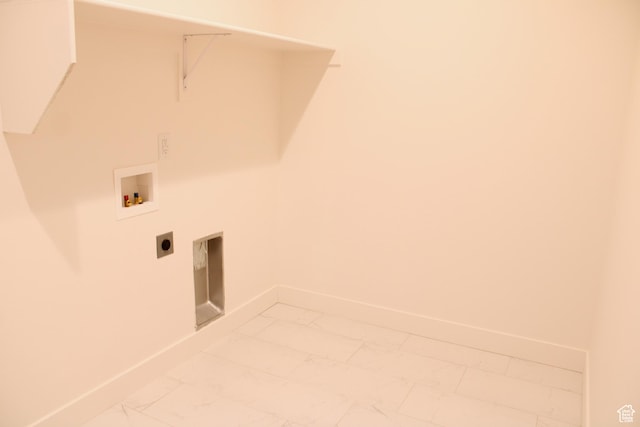 laundry room with baseboards, laundry area, and marble finish floor