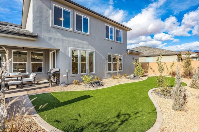 1378 N Marfil Way, Washington, UT 84780 - rear view of property with stucco siding, fence, a lawn, and a patio