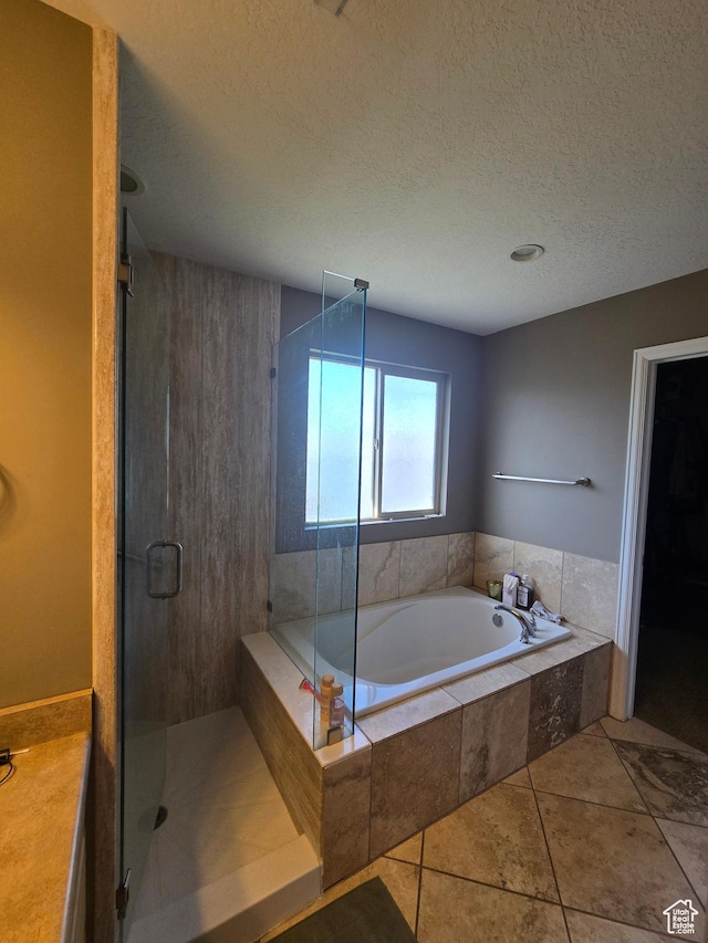 5564 S Yellow Fin Way W, Murray, UT 84107 - bathroom with a garden tub, a textured ceiling, a shower stall, and tile patterned flooring