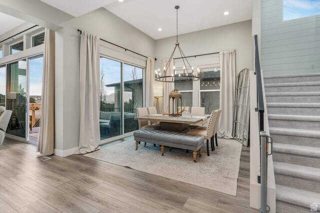 4772 W Thorntree Ln, Herriman, UT 84096 - dining area with recessed lighting, stairs, a notable chandelier, and wood finished floors