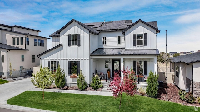 4772 W Thorntree Ln, Herriman, UT 84096 - modern farmhouse style home featuring covered porch, board and batten siding, and a standing seam roof