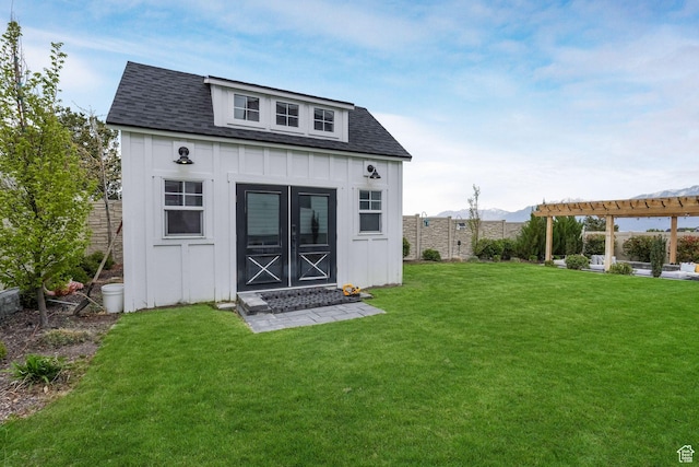 4772 W Thorntree Ln, Herriman, UT 84096 - view of outdoor structure with an outbuilding, a pergola, a fenced backyard, and a mountain view