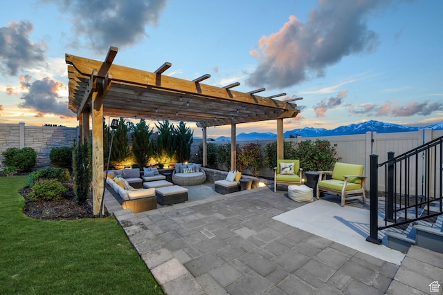 4772 W Thorntree Ln, Herriman, UT 84096 - patio terrace at dusk featuring a pergola, a mountain view, an outdoor living space, and a fenced backyard