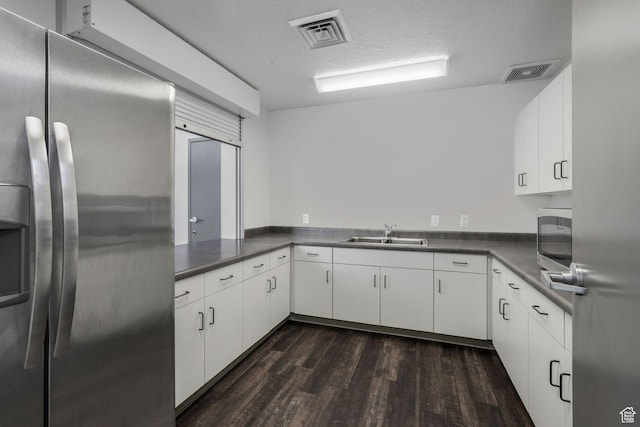 4772 W Thorntree Ln, Herriman, UT 84096 - kitchen featuring a sink, visible vents, dark wood finished floors, and stainless steel fridge with ice dispenser