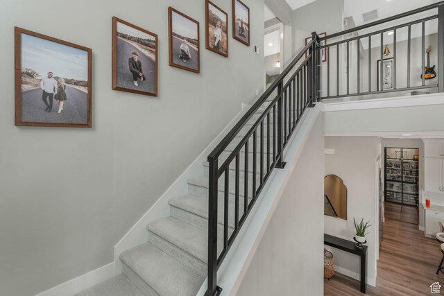4772 W Thorntree Ln, Herriman, UT 84096 - stairs featuring visible vents, wood finished floors, and baseboards