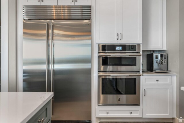 4772 W Thorntree Ln, Herriman, UT 84096 - kitchen featuring white cabinets, stainless steel appliances, and light countertops