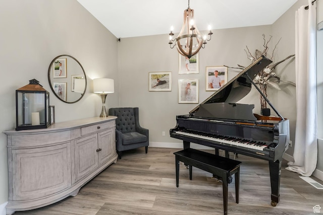 4772 W Thorntree Ln, Herriman, UT 84096 - living area with an inviting chandelier, light wood-style flooring, and baseboards