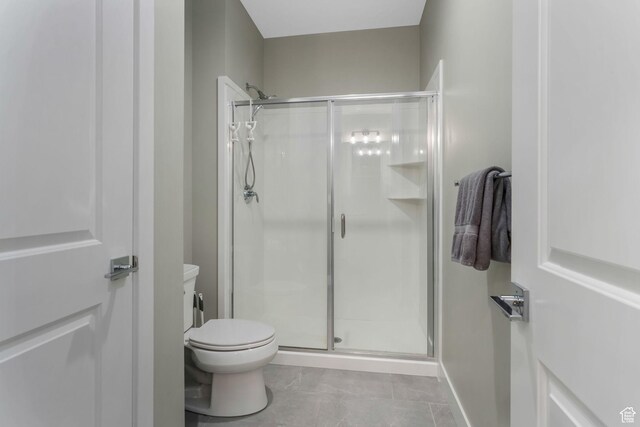 4772 W Thorntree Ln, Herriman, UT 84096 - bathroom featuring toilet, a stall shower, and tile patterned floors
