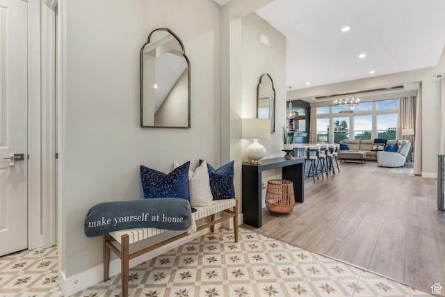 4772 W Thorntree Ln, Herriman, UT 84096 - living area with an inviting chandelier, wood finished floors, recessed lighting, and baseboards