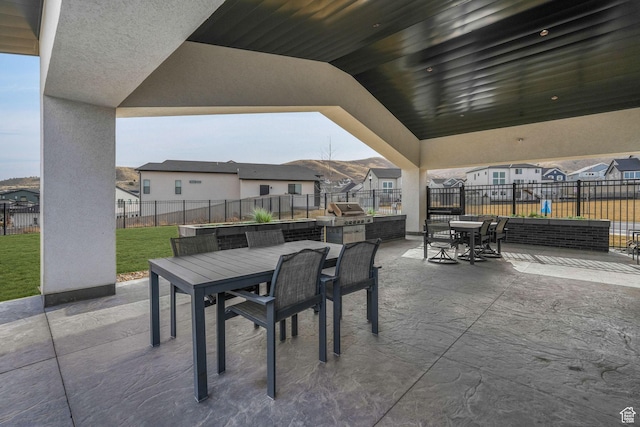 4772 W Thorntree Ln, Herriman, UT 84096 - view of patio featuring a residential view, area for grilling, outdoor dining area, and a fenced backyard