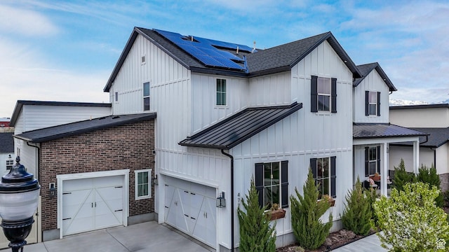 4772 W Thorntree Ln, Herriman, UT 84096 - modern farmhouse featuring driveway, board and batten siding, a standing seam roof, roof with shingles, and solar panels