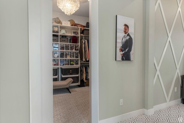 4772 W Thorntree Ln, Herriman, UT 84096 - hall featuring a chandelier, carpet flooring, and baseboards