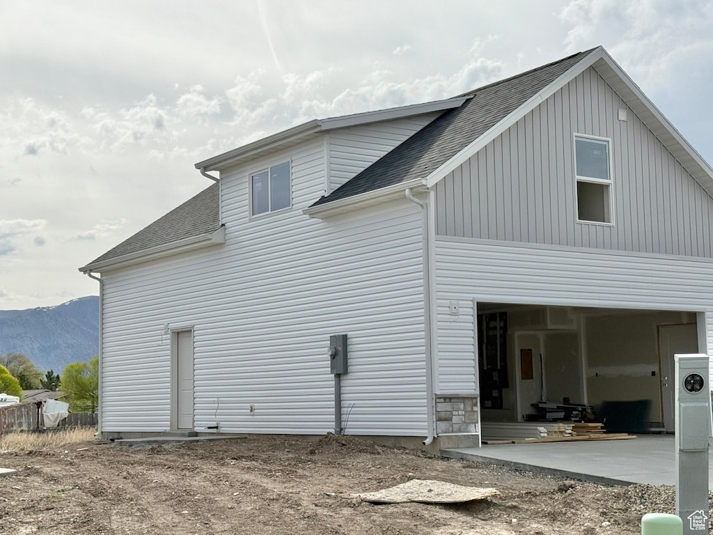 62 N 900 W, Garland, UT 84312 - view of side of property featuring a mountain view and a shingled roof