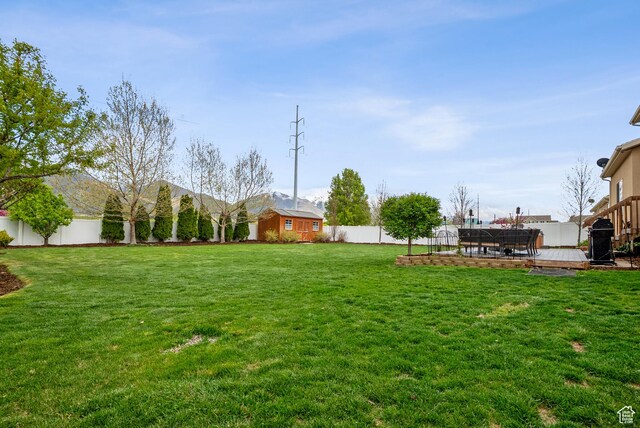 1030 S Barley Ln, Kaysville, UT 84037 - view of yard with a deck and a fenced backyard