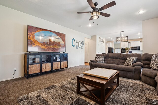 1030 S Barley Ln, Kaysville, UT 84037 - carpeted living area with baseboards, recessed lighting, and ceiling fan with notable chandelier