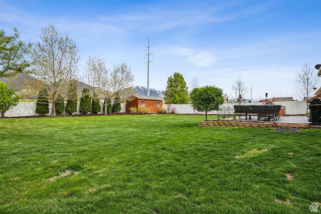 1030 S Barley Ln, Kaysville, UT 84037 - view of yard featuring a wooden deck and a fenced backyard