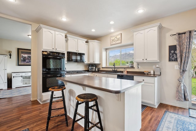 1030 S Barley Ln, Kaysville, UT 84037 - kitchen featuring white cabinetry, black appliances, dark wood-style flooring, and a sink