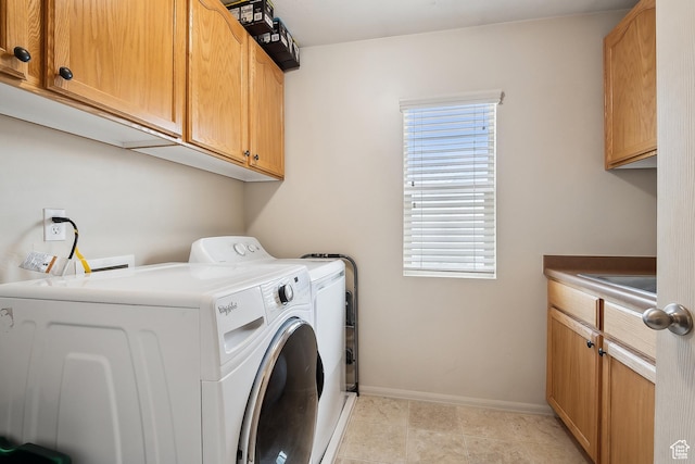 1030 S Barley Ln, Kaysville, UT 84037 - clothes washing area featuring plenty of natural light, cabinet space, baseboards, and washer and clothes dryer
