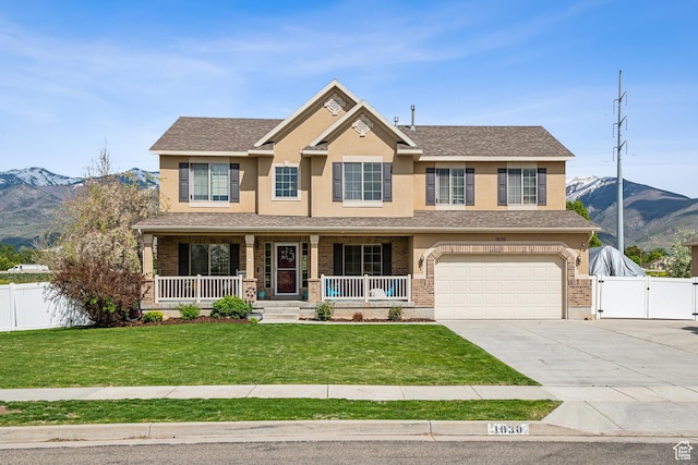 1030 S Barley Ln, Kaysville, UT 84037 - craftsman-style home with a gate, fence, driveway, a mountain view, and an attached garage