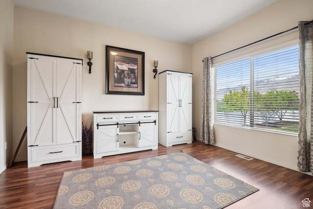 1030 S Barley Ln, Kaysville, UT 84037 - bedroom featuring visible vents, baseboards, and dark wood finished floors