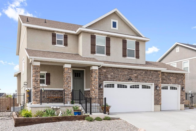view of front facade with fence, stucco siding, concrete driveway, and stone siding