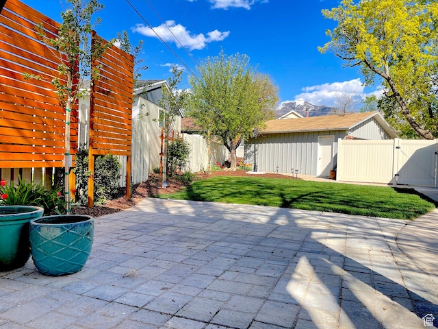 view of patio featuring a fenced backyard and a gate