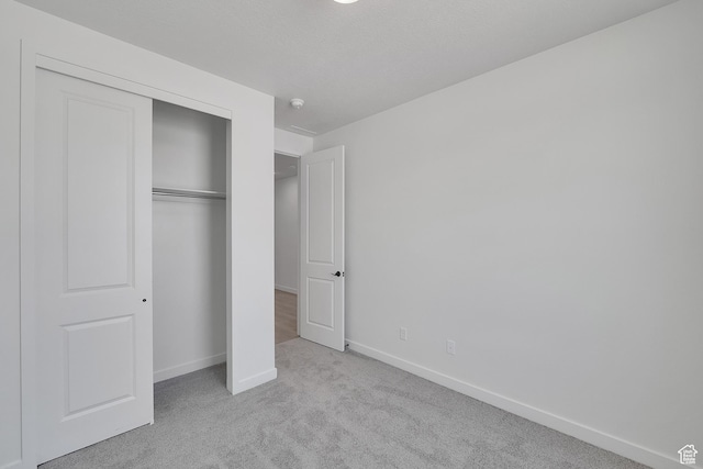 4099 W 2025 S Unit 51, Taylor, UT 84401 - unfurnished bedroom featuring carpet flooring and a closet
