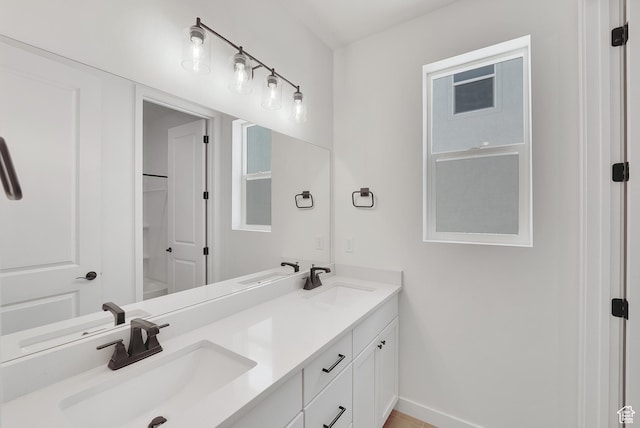 4099 W 2025 S Unit 51, Taylor, UT 84401 - full bathroom featuring double vanity and baseboards