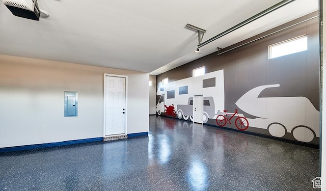 4099 W 2025 S Unit 51, Taylor, UT 84401 - garage featuring a garage door opener, electric panel, and baseboards