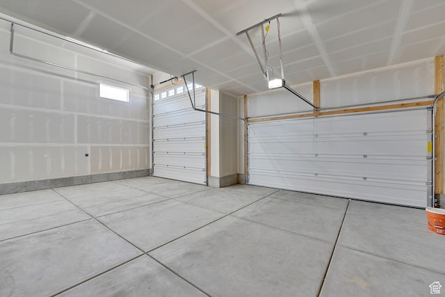 4099 W 2025 S Unit 51, Taylor, UT 84401 - garage featuring a garage door opener